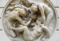 Bacchanale de Jules Dalou, sculptée dans une pierre de Tercé, vers 1895-1898.   Fontaine du jardin des Serres d'Auteuil, Paris.